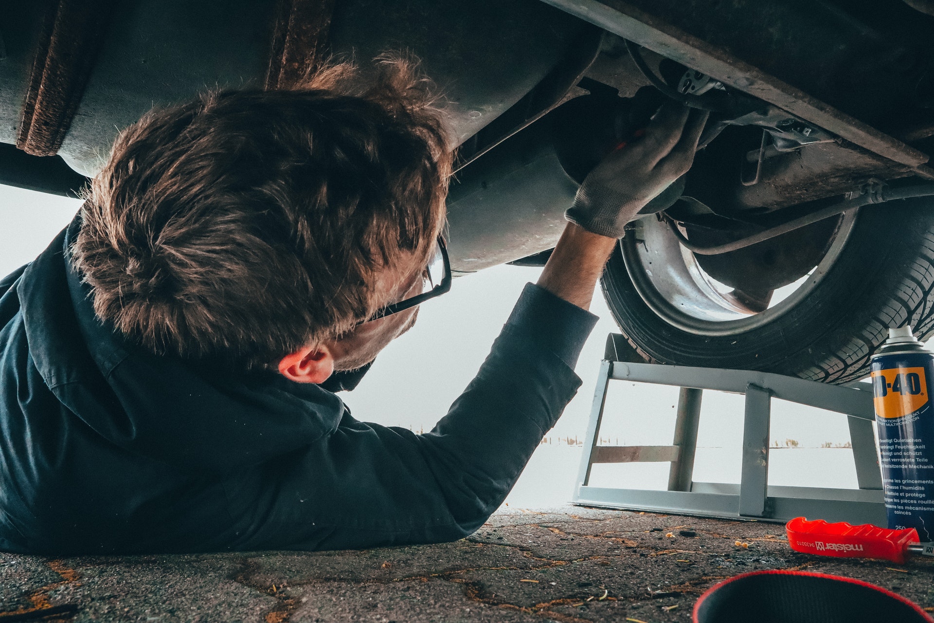 Man working on a vehicle.